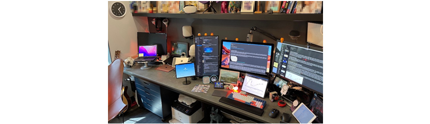 The efficient work environment using three monitors and one tablet connected to the computer - image