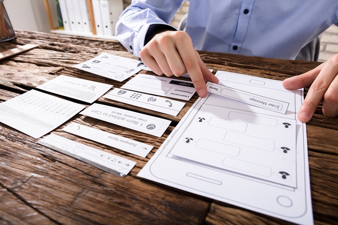 Close-up Of A Designer's Hand Designing Mobile Application