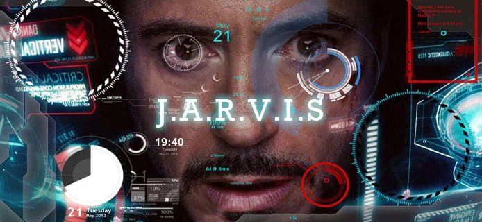 영화 아이언맨의 AI 어시스턴트 JARVIS를 구현한 장면으로, 토니 스타크의 얼굴에 미래적인 홀로그래픽 인터페이스와 각종 데이터 시각화 요소들이 오버레이되어 고도화된 AI 상호작용을 보여줍니다.